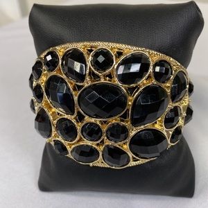 Large Goldtone and black faceted bead clamper bracelet